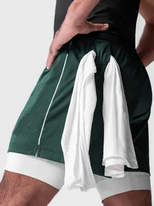 Pantalones cortos deportivos de doble capa para hombre con lazo para toalla y bolsillo.