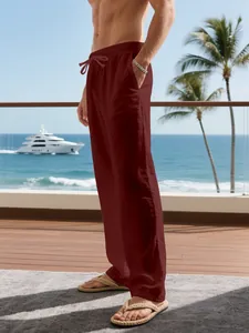Side detail of men's loose breathable burgundy linen drawstring vacation pants