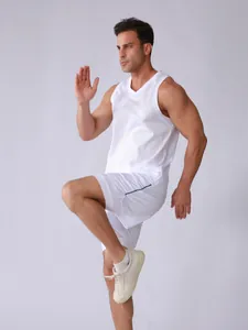 Action shot of men's white breathable sleeveless tank top and matching sports shorts set