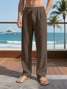 Men's breathable brown linen trousers with drawstring perfect for a casual beach vacation