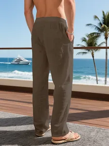 Back view of men's loose brown linen-texture straight-leg pants for beach vacation