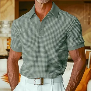 Detailed view of men's sage green waffle knit polo shirt showing rich fabric texture