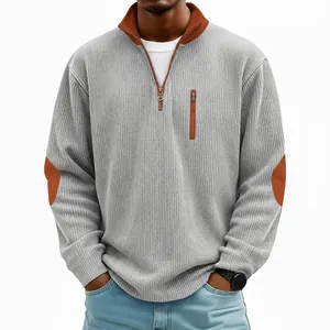Detail view of men's grey ribbed corduroy half-zip sweatshirt with brown elbow patches.