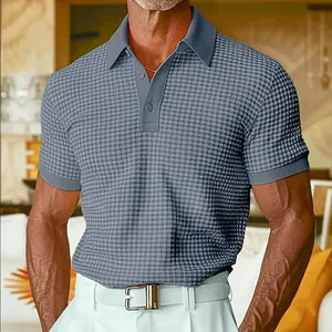 Detail showing the texture and fit of the grey waffle knit short sleeve polo shirt.