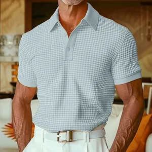 Close-up of men's light blue waffle-knit polo shirt with textured fabric and classic collar.