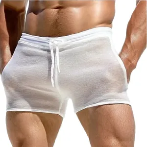 Sexy men's white drawstring shorts featuring semi-transparent fabric for lounge or fitness.
