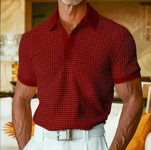Detail shot of men's red waffle-knit polo shirt showing fabric texture and placket