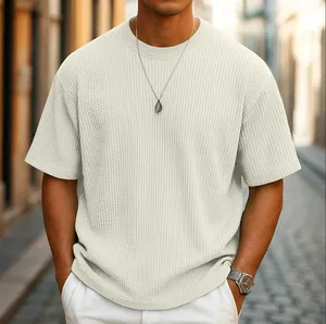 Detailed view of men's cream waffle texture short sleeve t-shirt in casual street style