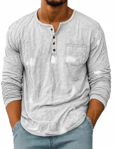 Close-up detail of grey long sleeve Henley shirt with chest pocket and slub texture