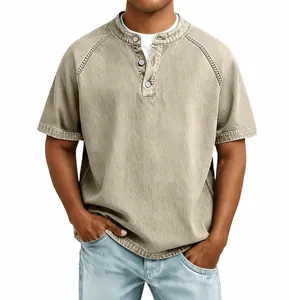 Close-up detail of men's vintage washed cotton Henley short sleeve shirt in khaki