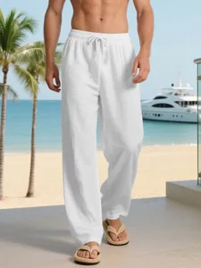 Relaxed fit men's white linen drawstring trousers for beach and resort vacation