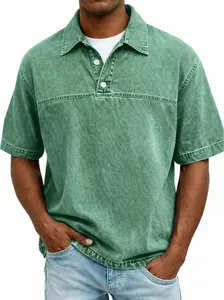 Detail of a men's vintage wash green polo shirt featuring a classic collar and buttons