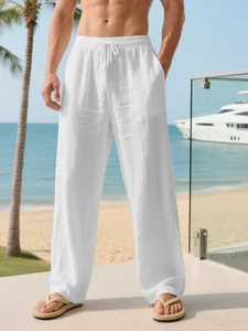 Men's breathable white linen trousers with drawstring waist and loose fit for beach vacation