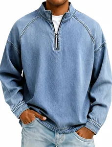 Macro view of vintage washed denim half-zip pullover showing collar and zipper details