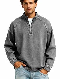 Close-up of the quarter-zip collar and washed cotton texture of the grey henley top