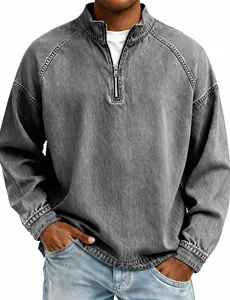 Close-up of the quarter-zip collar and washed cotton texture of the grey henley top