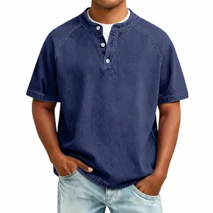 Detail of vintage washed cotton Henley shirt with buttoned collar and raglan sleeves.