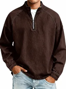 Close-up detail of vintage brown half-zip sweatshirt for men with washed-out texture.