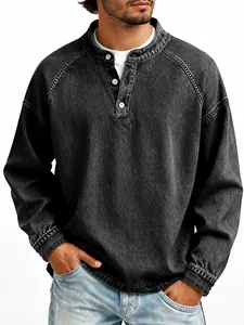 Close-up of a men's vintage washed cotton Henley long sleeve shirt in grey denim style