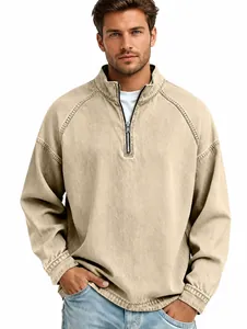 Close-up of men's vintage washed cotton quarter-zip long sleeve shirt in beige