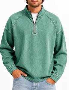 Detail of men's vintage washed green cotton top with half-zip henley collar