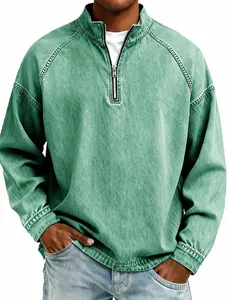 Detail of men's vintage washed green cotton top with half-zip henley collar