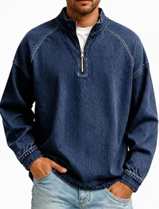 Close-up of men's vintage washed denim quarter-zip pullover with metal zipper detail.