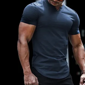 Close-up of men's muscle fit V-neck casual t-shirt in dark grey with curved hem line.