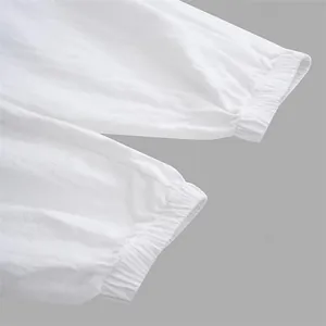 Detail view of high-quality white elasticated cuffs on men's casual outdoor cotton beach pants