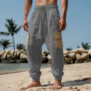 Detailed shot of men's gray cargo beach pants with contrasting tan side pockets