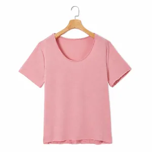 Detail view of pink short sleeve T-shirt with a simple scoop neck and soft cotton texture