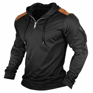 Detailed view of stylish men's black hooded sweatshirt with brown contrast shoulder patches