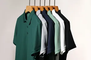 Detailed view of men's heavyweight casual polo shirts in multiple colors on hangers.