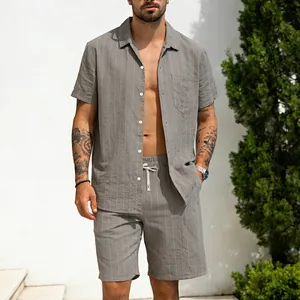 Detailed view of casual grey striped linen two-piece outfit worn by male model outdoors