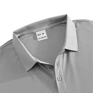 Detailed macro shot of a men's polo shirt collar featuring the 100% polyester label