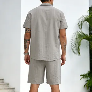 Back view of a casual men's grey pinstripe linen shirt and shorts set in a summer style