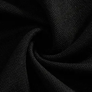 Close-up macro view of black quick-dry breathable pique fabric texture for men's polo shirt