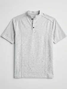 Detailed view of grey knit men's polo shirt with mandarin collar and black buttons