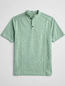 Detail view of men's green knit polo shirt with stand collar and button placket