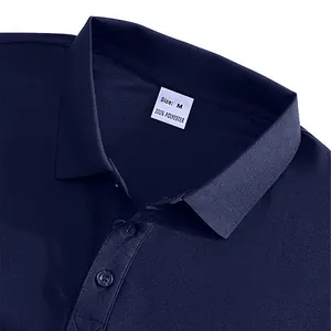Macro view of navy blue polo shirt collar showing 100% polyester tag