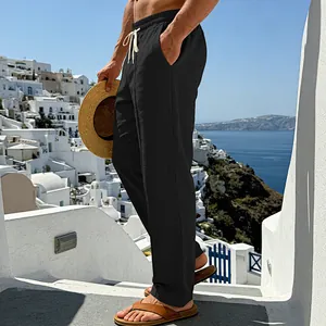 Breathable black linen wide-leg pants for men shown in a casual outdoor setting