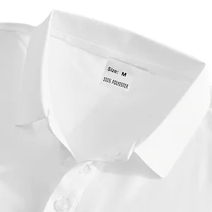 Detailed view of white polo shirt collar with size M and 100% polyester label