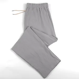 Detailed view of breathable grey linen wide-leg pants for men with elastic drawstring waist
