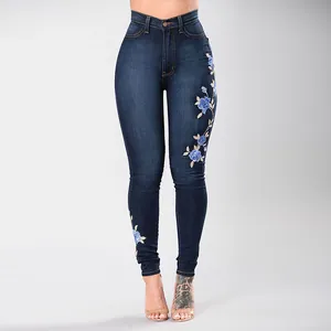 Stylish high-waisted slim fit dark blue denim jeans featuring blue floral embroidery for women