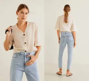 Front and back views of light blue high-waisted slim straight-leg denim jeans for women