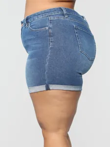 Detailed side view of high-waisted plus size stretch denim shorts featuring a cuffed hem