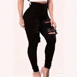 High-waisted black ripped skinny jeans for women featuring heavy distressed frayed details