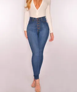 Detailed close-up showing the high waisted fit and button fly closure of these blue denim jeans