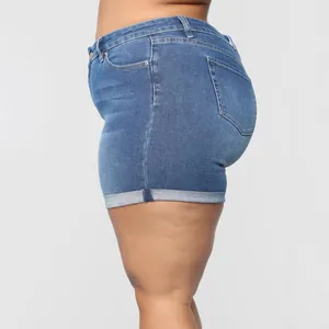 Stylish women's plus size stretchy denim shorts with cuffed hem design, side profile view