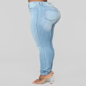 Side view of high-waisted light blue skinny jeans with back pocket detail
